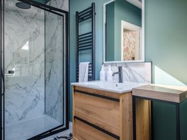 A bathroom with a shower and sink at Riverside in Ambleside