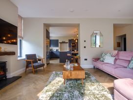 A living room with a coffee table and sofa at Riverside in Ambleside