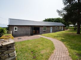 A house with a pathway and grass at Henhouse Farm Bodenham