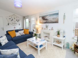 A living room with a sofa and coffee table at The Sanctuary Badgers Retreat Holiday Park near Catterick Garrison, North Yorkshire