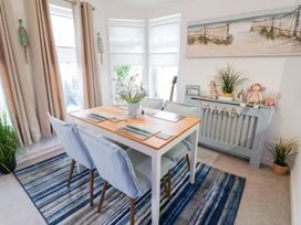 A dining room with a table and chairs at The Sanctuary Badgers Retreat Holiday Park near Catterick Garrison, North Yorkshire