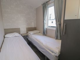 A bedroom with two single beds at Lido Gold 120 Prestatyn