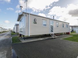 A mobile home with steps and windows at Lido Gold 273 in Prestatyn
