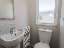 A bathroom with a sink and toilet at Lido Gold 273 Prestatyn