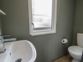 A bathroom with a sink and toilet at Woodlands Gold (WO06) in Ruthin