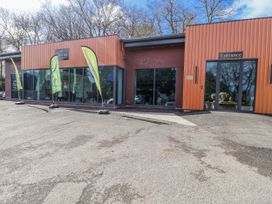 A building entrance with flags outside at Woodlands Gold (WO06) in Ruthin