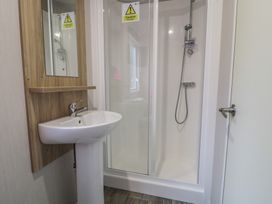 A bathroom with sink and shower at Woodlands Platinum (WO29) Ruthin