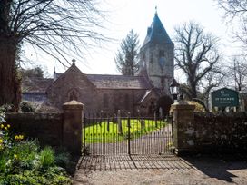 A church with a tower and gate at St Maurice in Eglingham