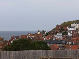 A view of houses and the sea at Falcon's Nest in Whitby