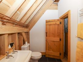 A bathroom with a sink and toilet at Pucklechurch in Kingsteignton