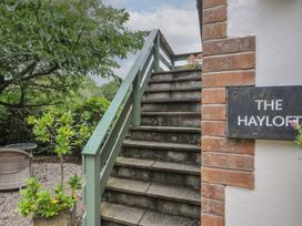 Stairs leading to The Hayloft with sign at Lostwithiel