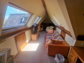 A living room with a sofa and armchair at Ashleigh House