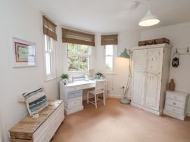 A bedroom with a desk and chair at Happy Days in Scarborough