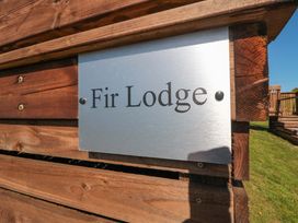 A sign displaying the name Fir Lodge outdoor at Fir Lodge in Whitby