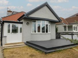 A house with a deck and front garden at Gorse Hill