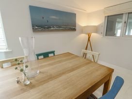 A dining room with a table and chairs at Gorse Hill