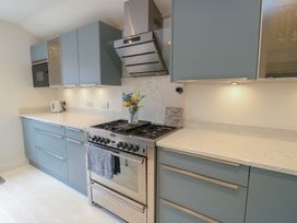 A kitchen with an oven and cabinets at Gorse Hill