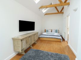 A bedroom with a bed and television at Gorse Hill 