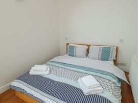 A bedroom with a bed and towels at Gorse Hill