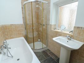 A bathroom with a bathtub and shower at Gorse Hill