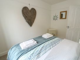 A bedroom with towels on the bed at Gorse Hill 