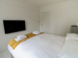 A bedroom with a bed and television at Gorse Hill