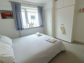 A bedroom with a bed and wardrobe at Gorse Hill