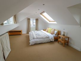 A bedroom with a bed and a nightstand at Gorse Hill