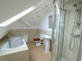 A bathroom with tub, shower, toilet and sink at Gorse Hill