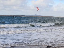 A kite surfer on the water at Gorse Hill in Rhosneigr