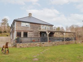 A house with a balcony and garden at Shanti Gher in Bantry