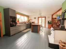 A kitchen with an island and an oven at Shanti Gher in Bantry