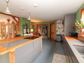 A kitchen with an island and appliances at Shanti Gher in Bantry