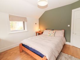 A bedroom with a bed and bedside table at Shanti Gher in Bantry
