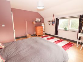 A bedroom with a bed and a wooden drawer at Shanti Gher in Bantry