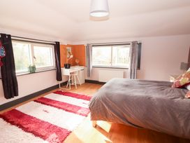 A bedroom with a bed and desk at Shanti Gher in Bantry