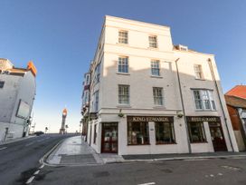 A restaurant building in Weymouth with a sign on the front at Betty's Buoy