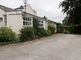 A house exterior with garden and seating area at Pippins Ambleside