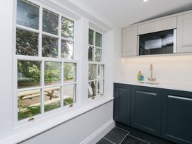 A kitchen with a sink and a microwave at Pippins in Ambleside
