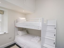 A bedroom with a bunk bed and a bottom bed at Pippins in Ambleside