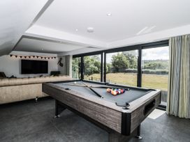 A snug with a pool table and television at Number 7 in Bishop Sutton
