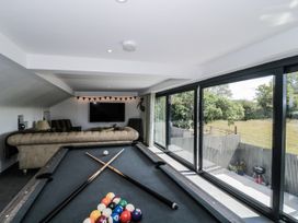 A game room featuring a pool table and large windows at Number 7 in Bishop Sutton