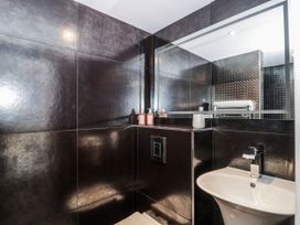 A bathroom with a sink and mirror at Number 7 in Bishop Sutton
