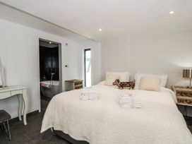 A bedroom with a bed and desk at Number 7 in Bishop Sutton