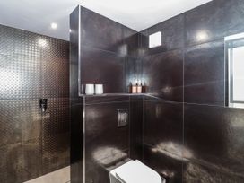 A bathroom with a toilet and shower at Number 7 in Bishop Sutton