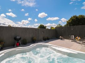 An outdoor area with a hot tub and grill at Number 7 in Bishop Sutton