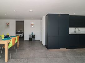 A kitchen with a dining area and modern appliances at Number 7 in Bishop Sutton