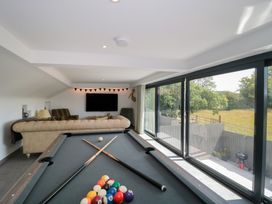 A recreation room with a pool table and a sofa at Number 7 in Bishop Sutton