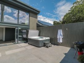 An outdoor space with a hot tub and grill at Number 7 in Bishop Sutton
