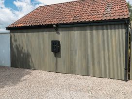 An outdoor view of a building with an electric vehicle charger at Number 7 in Bishop Sutton